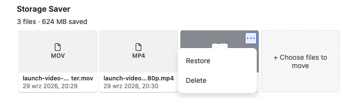 The ⋯ menu open on a moved file's tile, listing Restore and Delete